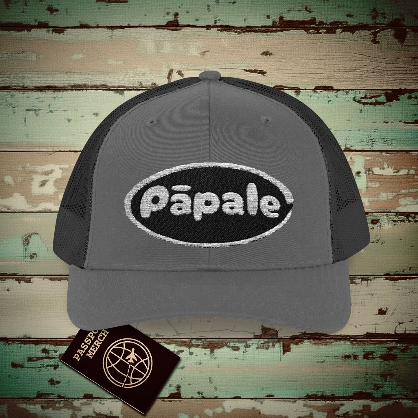Hawaiian Language Embroidered Trucker Hat that says Hat (Papale) Charcoal / Black / One size